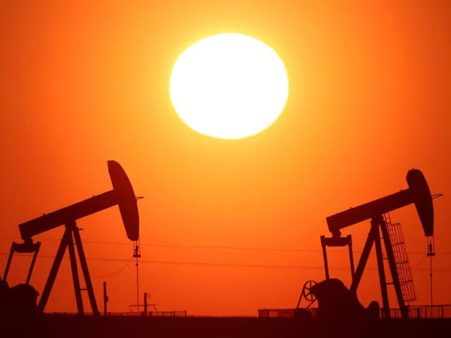 Oil pumps silhouetted at sunset