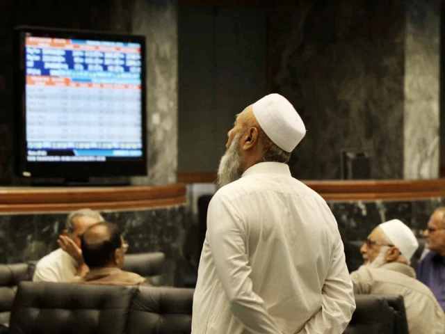 An investor watching a market display board