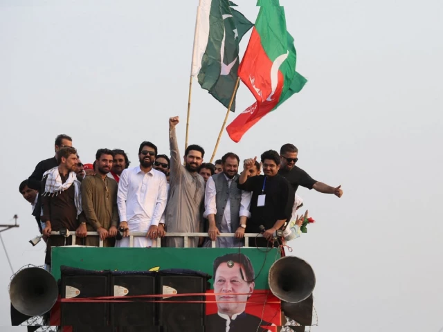 Opposition supporters with party flags at a political gathering
